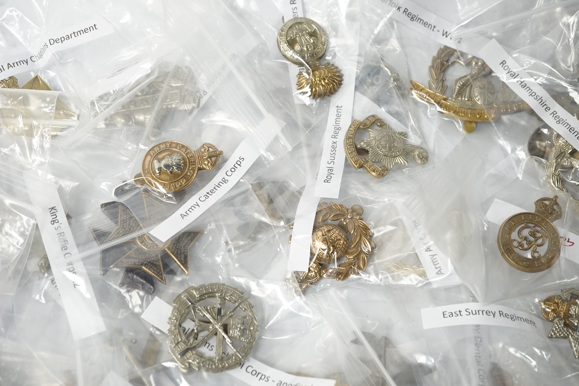 Forty military cap badges including; the Cambridgeshire regiment, Intelligence Corps, King’s Rifle Corps, Army Catering Corps, Small Arms School Corps, Duke of Wellington’s West Riding regiment, Royal Military College, R